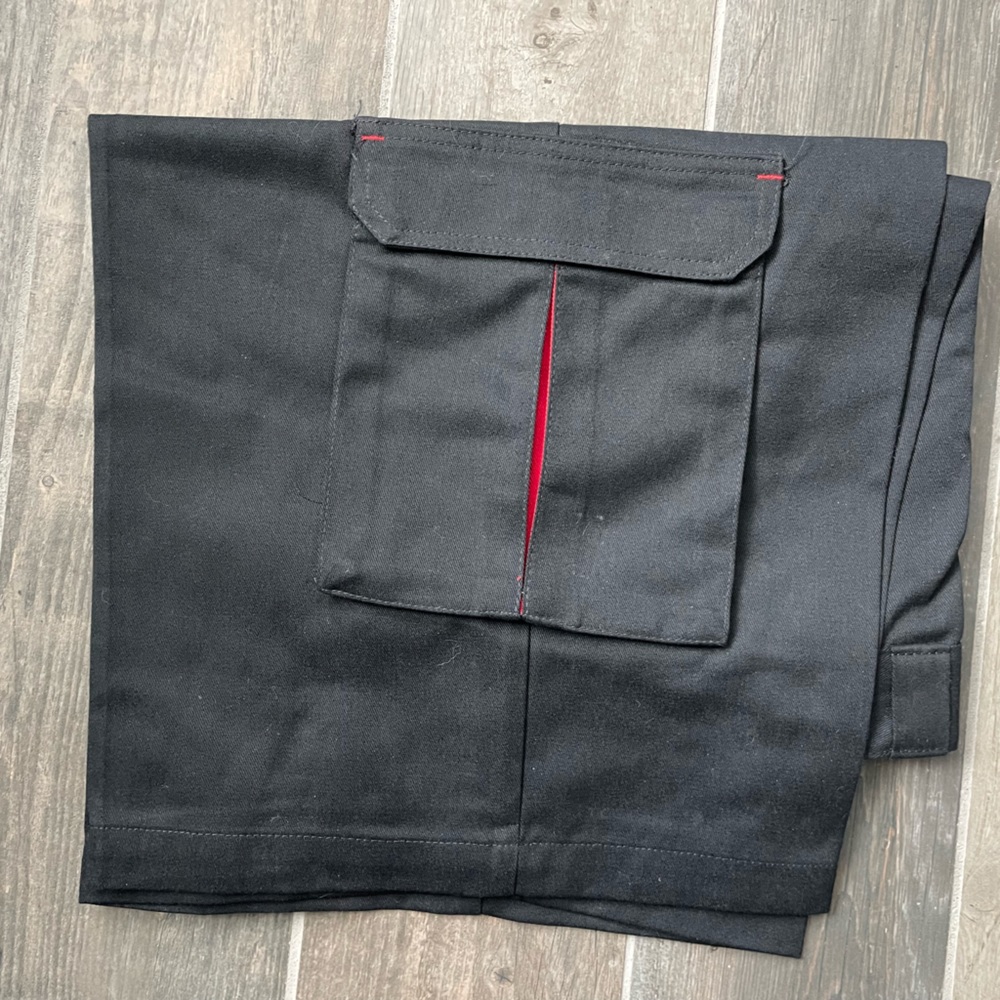 Men’s black Dickies skateboarding shorts with red trimmed side pockets, 34 waist